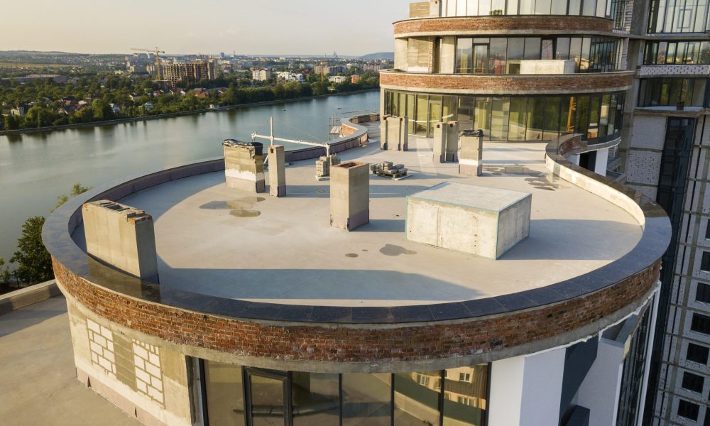Aerial view of new modern skyscraper building under construction.